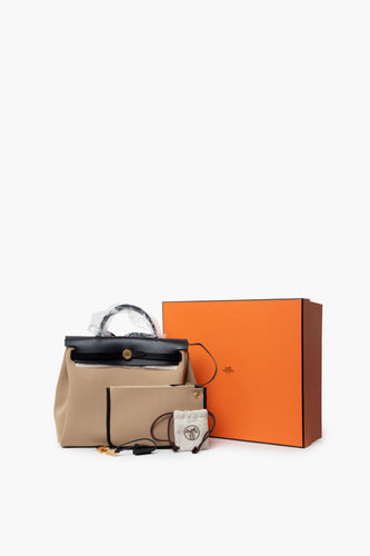 New Hermes Beige Herbag 31 Shoulder Bag displayed with original Hermes box and accessories on a white background.